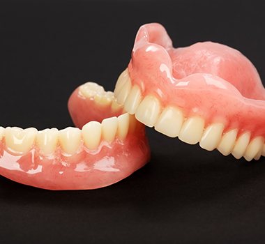 Full dentures for upper and lower arch on black background
