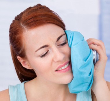 Woman using cold compress