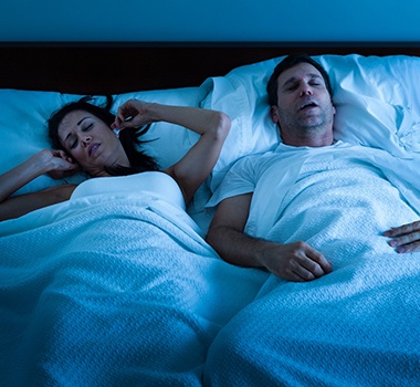 woman disturbed by partner’s snoring 