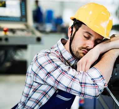 man sleeping at work 