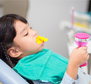 Child receiving fluoride treatment