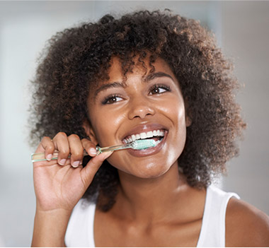 Woman brushing her teeth