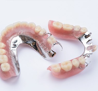 Custom-designed partial dentures on a white surface