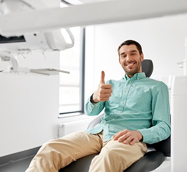 Man giving thumbs up after smile makeover in Landrum, SC