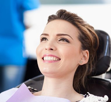 woman at a dental checkup to prevent dental emergencies in Landrum 