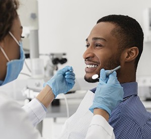 man at a checkup with his dentist 