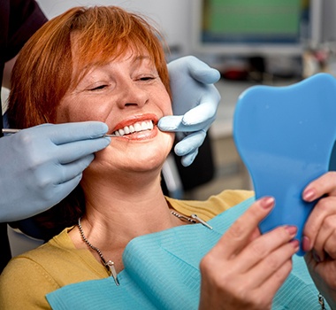 Woman smiling in the dental chair