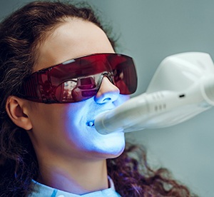 Woman having in-office whitening treatment