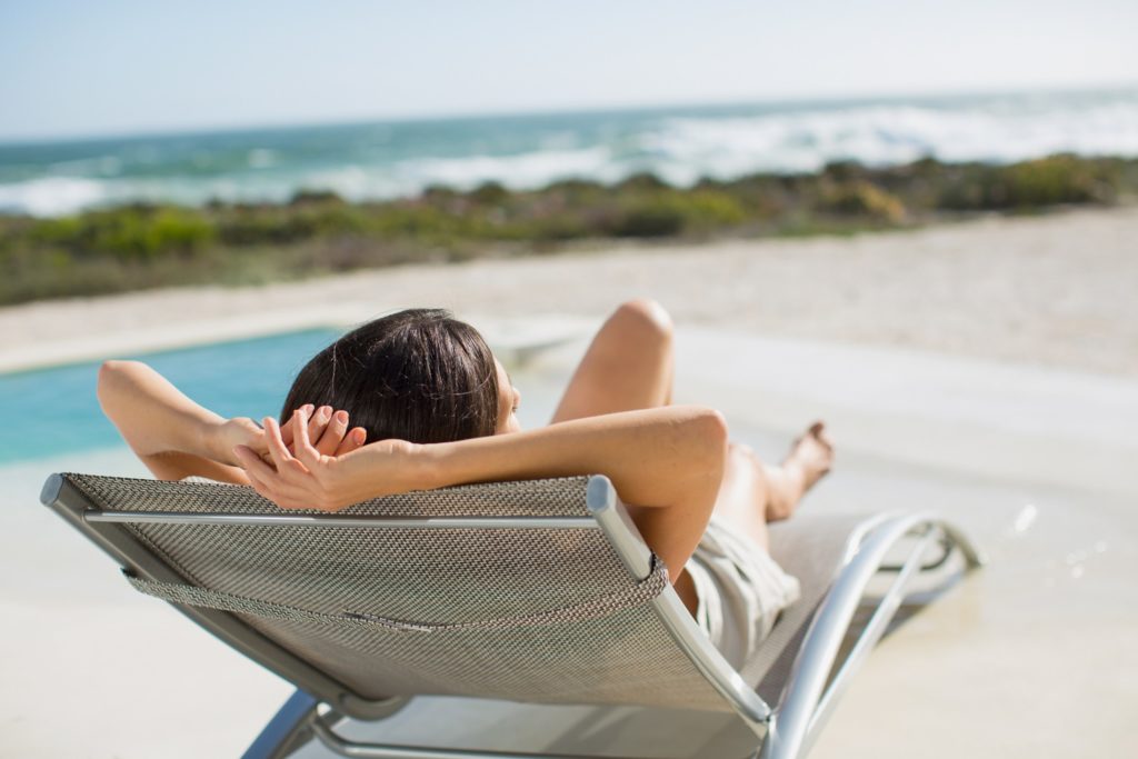 Woman sunbathing on the beach