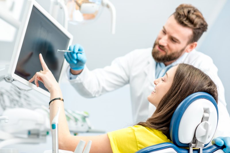 dentist speaking to patient about root canal cost