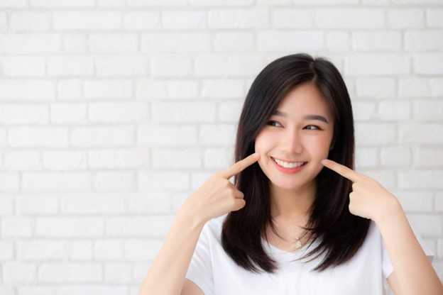 person smiling after full mouth reconstruction