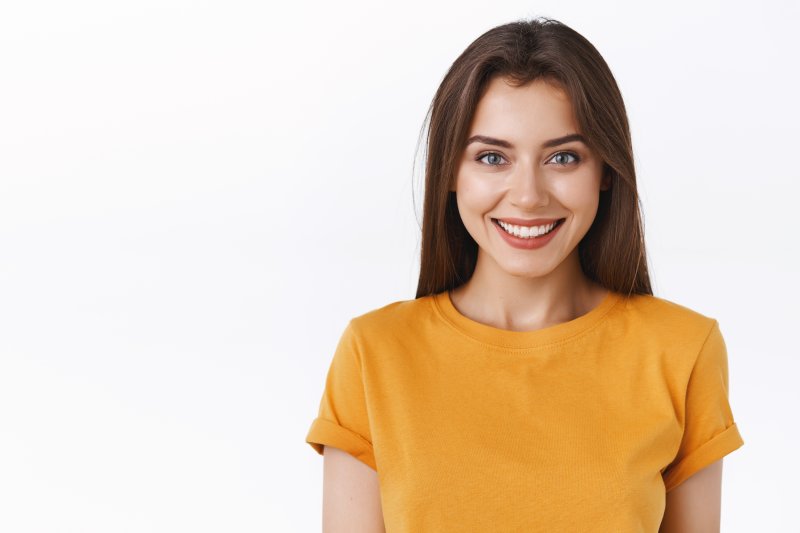 person with dental implants smiling