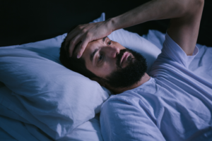 a person with sleep apnea struggling to fall asleep